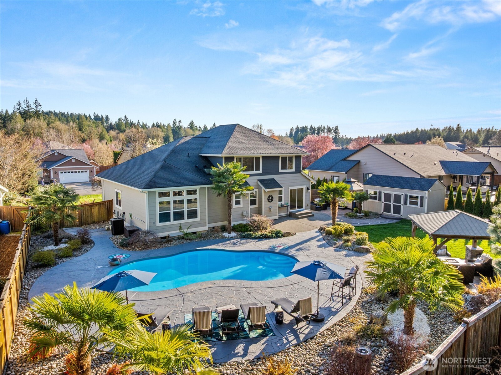 4244 90th Way Southeast Olympia, WA 98501 - Photo 1 of 40 an aerial view of a house with swimming pool garden and patio