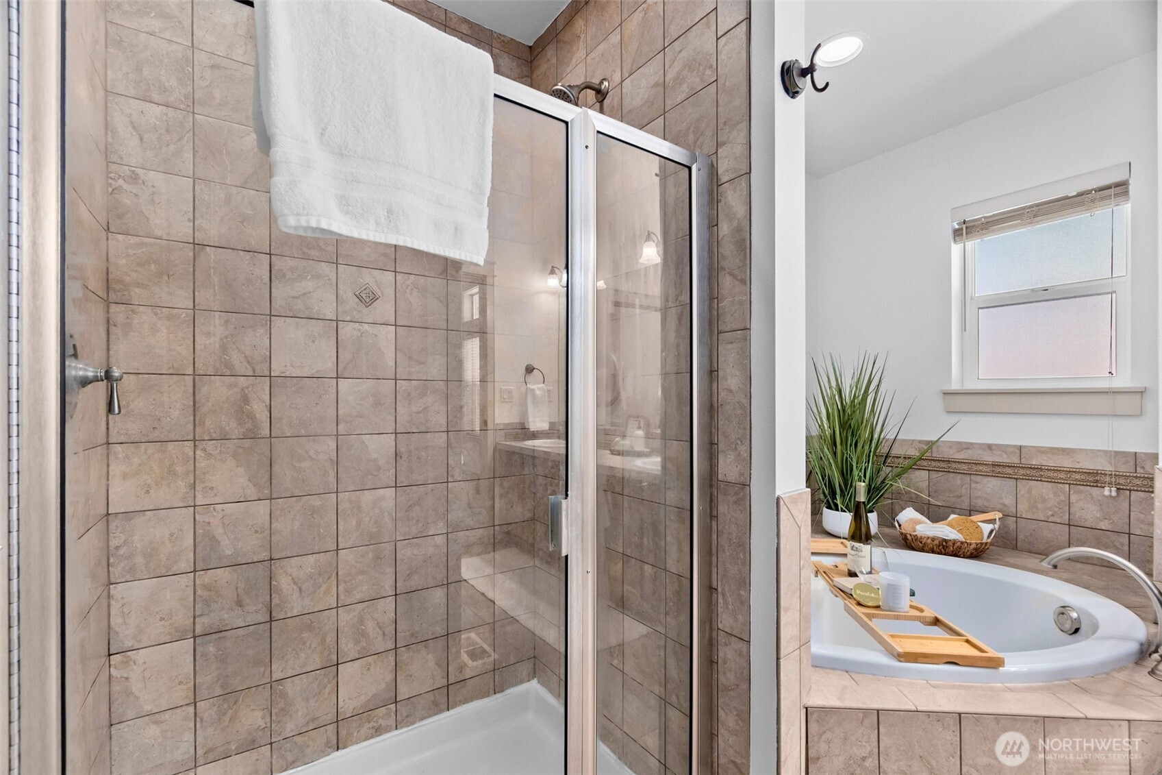 4244 90th Way Southeast Olympia, WA 98501 - Photo 20 of 40 a bathroom with a tub shower and sink