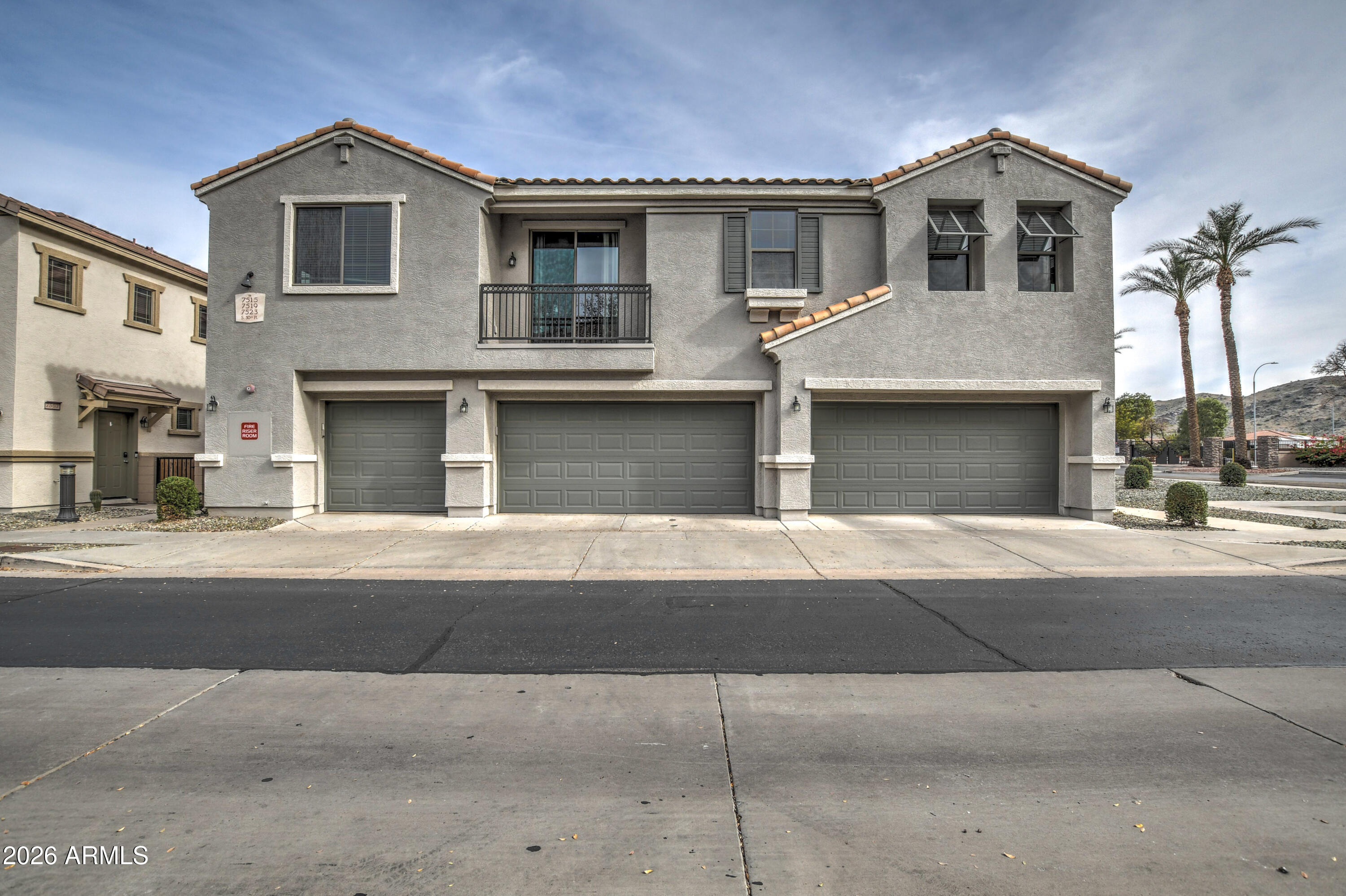 7515 South 30th Place Phoenix, AZ 85042 - Photo 1 of 23 a front view of a house with a yard and garage