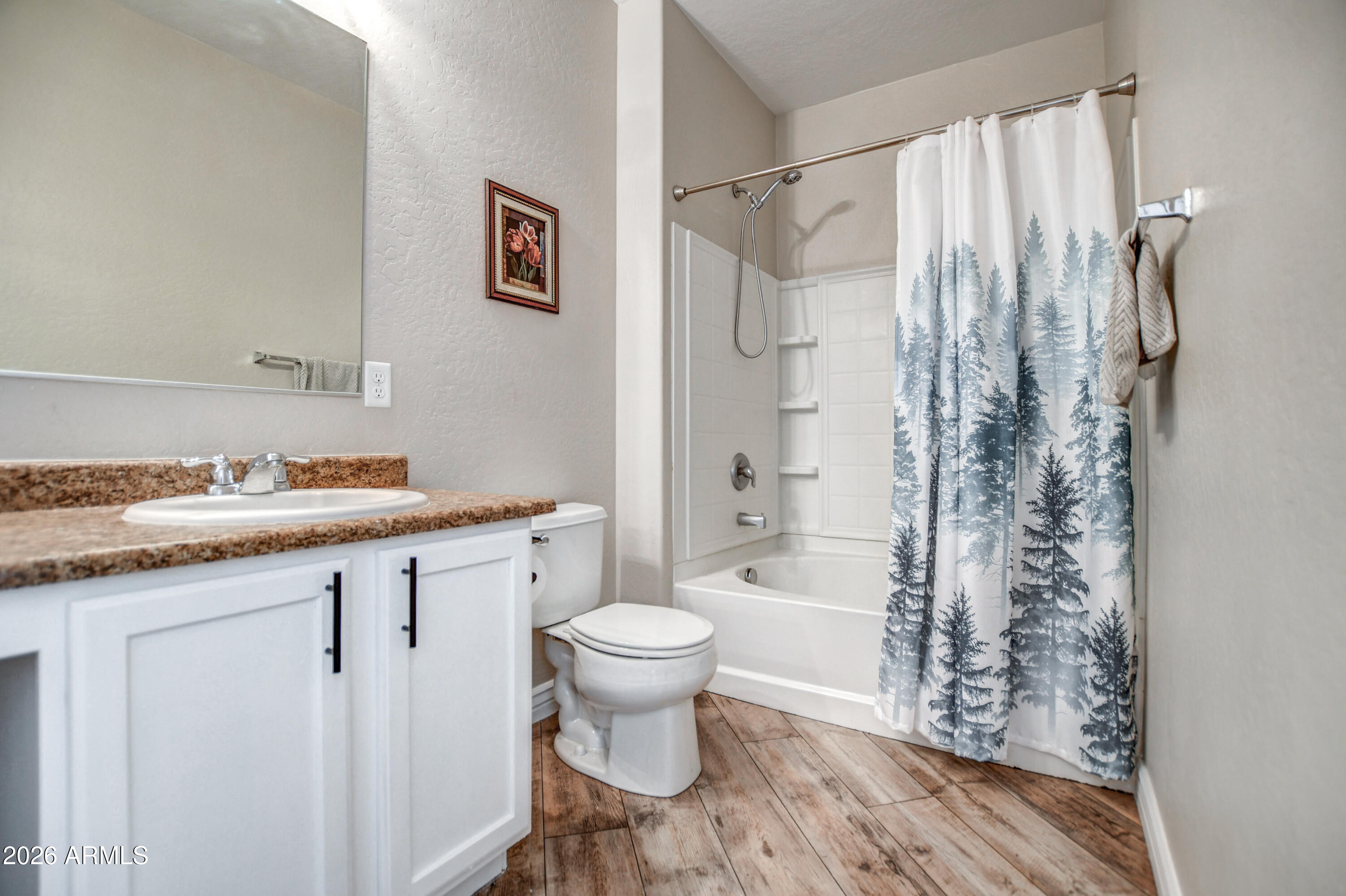 7515 South 30th Place Phoenix, AZ 85042 - Photo 11 of 23 a bathroom with a granite countertop sink toilet and shower