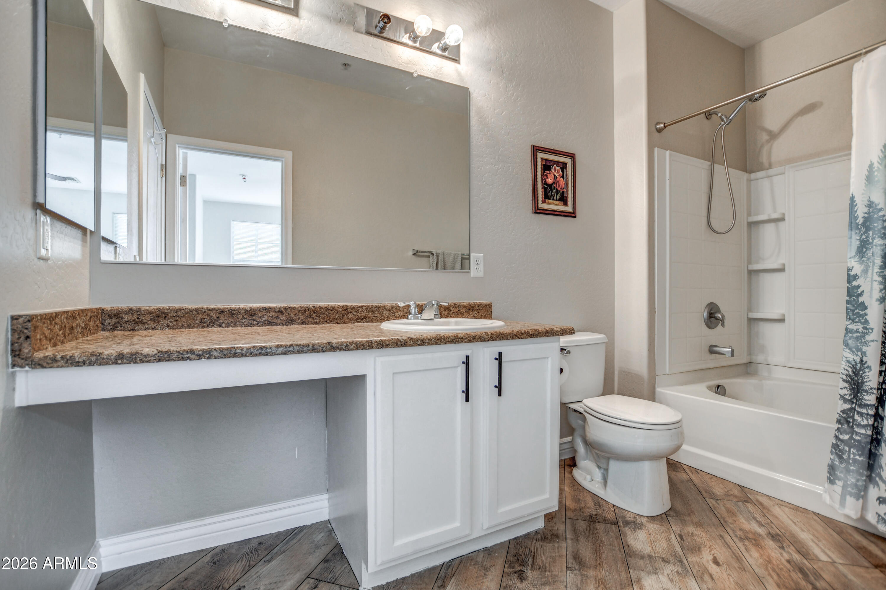 7515 South 30th Place Phoenix, AZ 85042 - Photo 12 of 23 a bathroom with a sink toilet and shower
