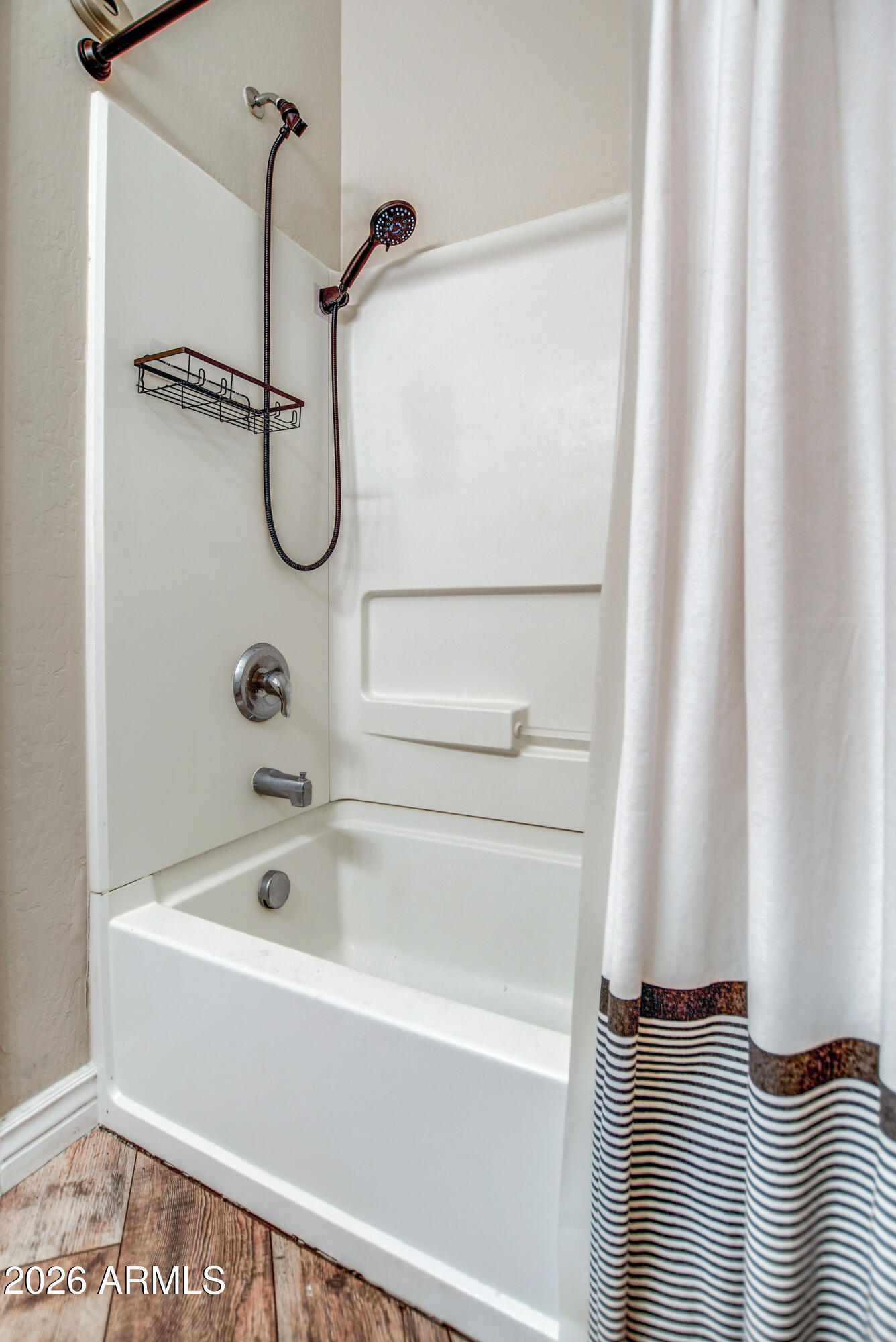 7515 South 30th Place Phoenix, AZ 85042 - Photo 15 of 23 a bathroom with a shower and a tub