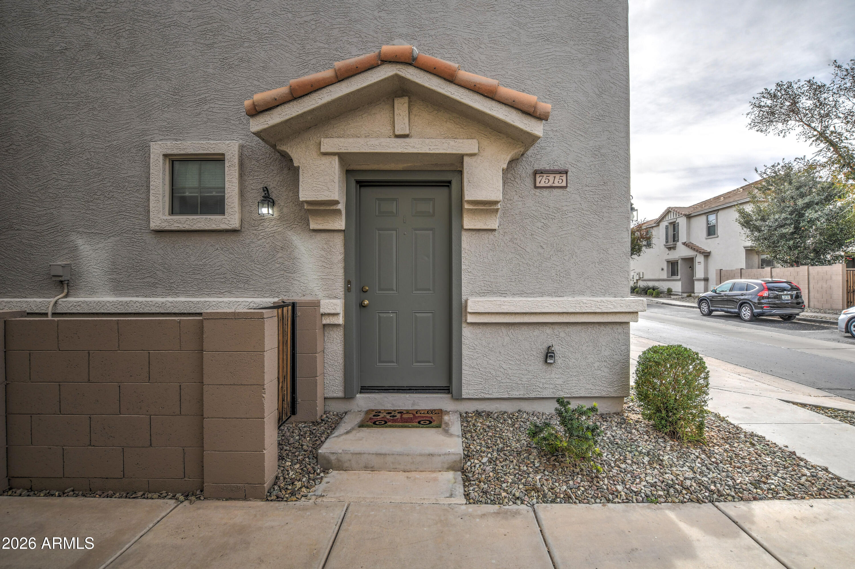 7515 South 30th Place Phoenix, AZ 85042 - Photo 2 of 23 a view of a car park in front of house