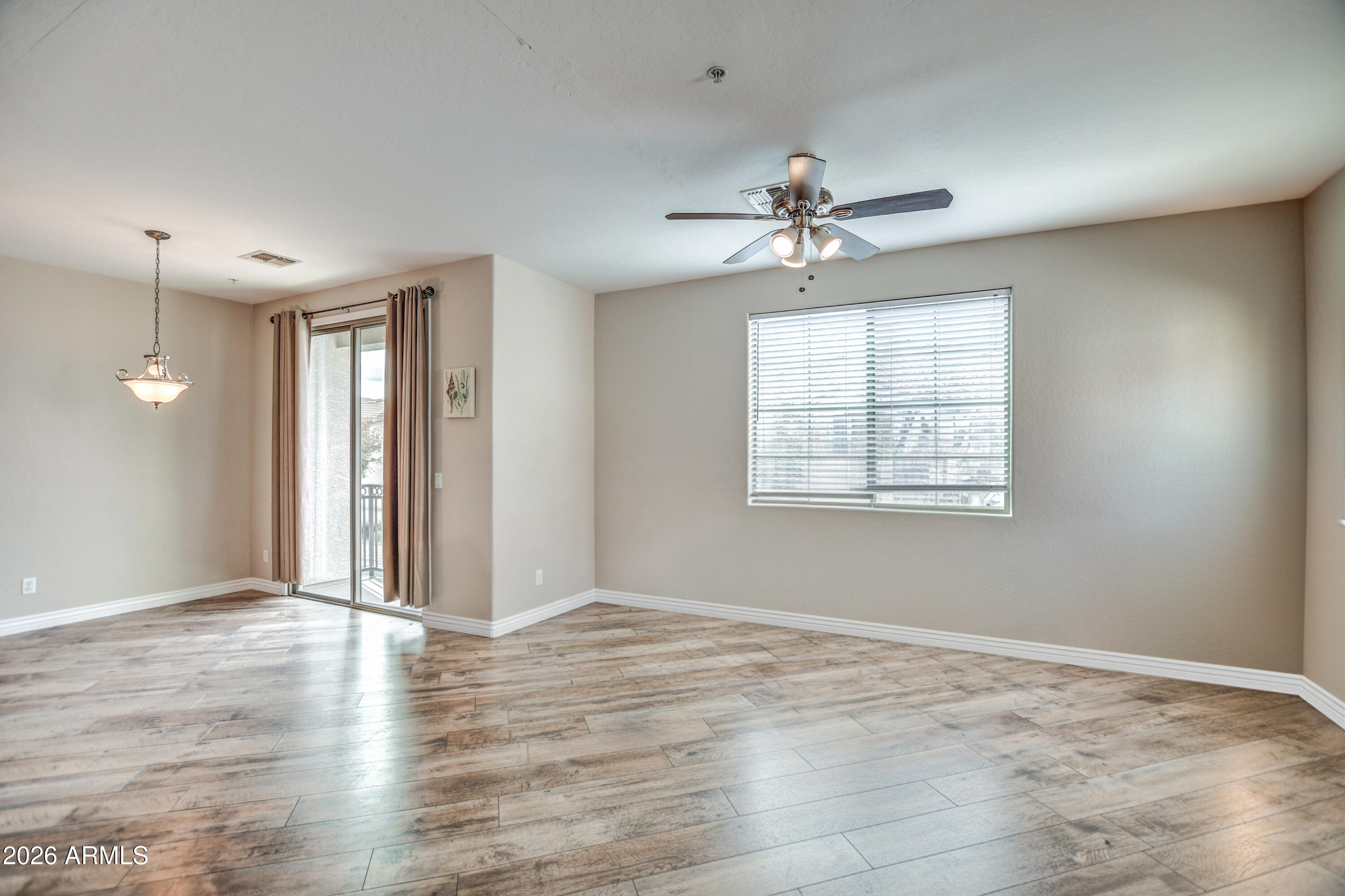 7515 South 30th Place Phoenix, AZ 85042 - Photo 23 of 23 wooden floor in an empty room with a window