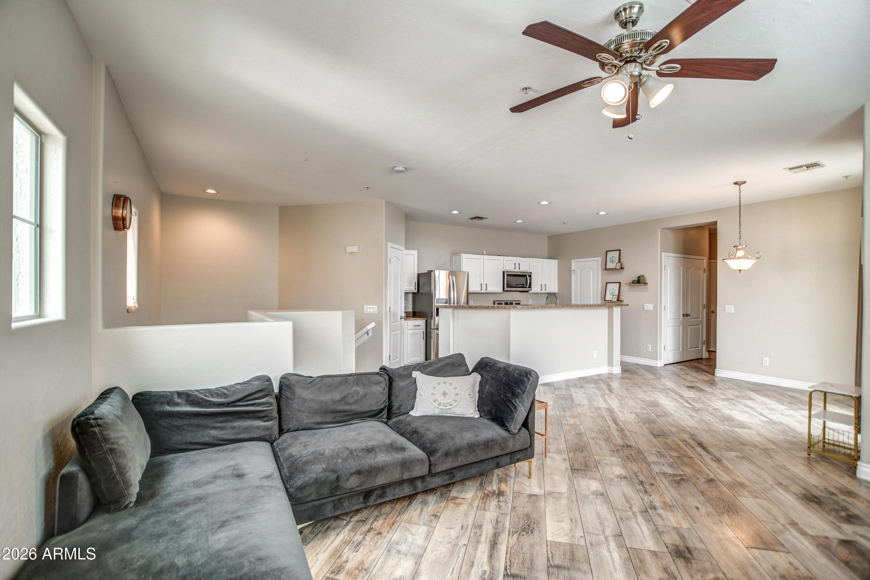 7515 South 30th Place Phoenix, AZ 85042 - Photo 8 of 23 a living room with furniture and a ceiling fan