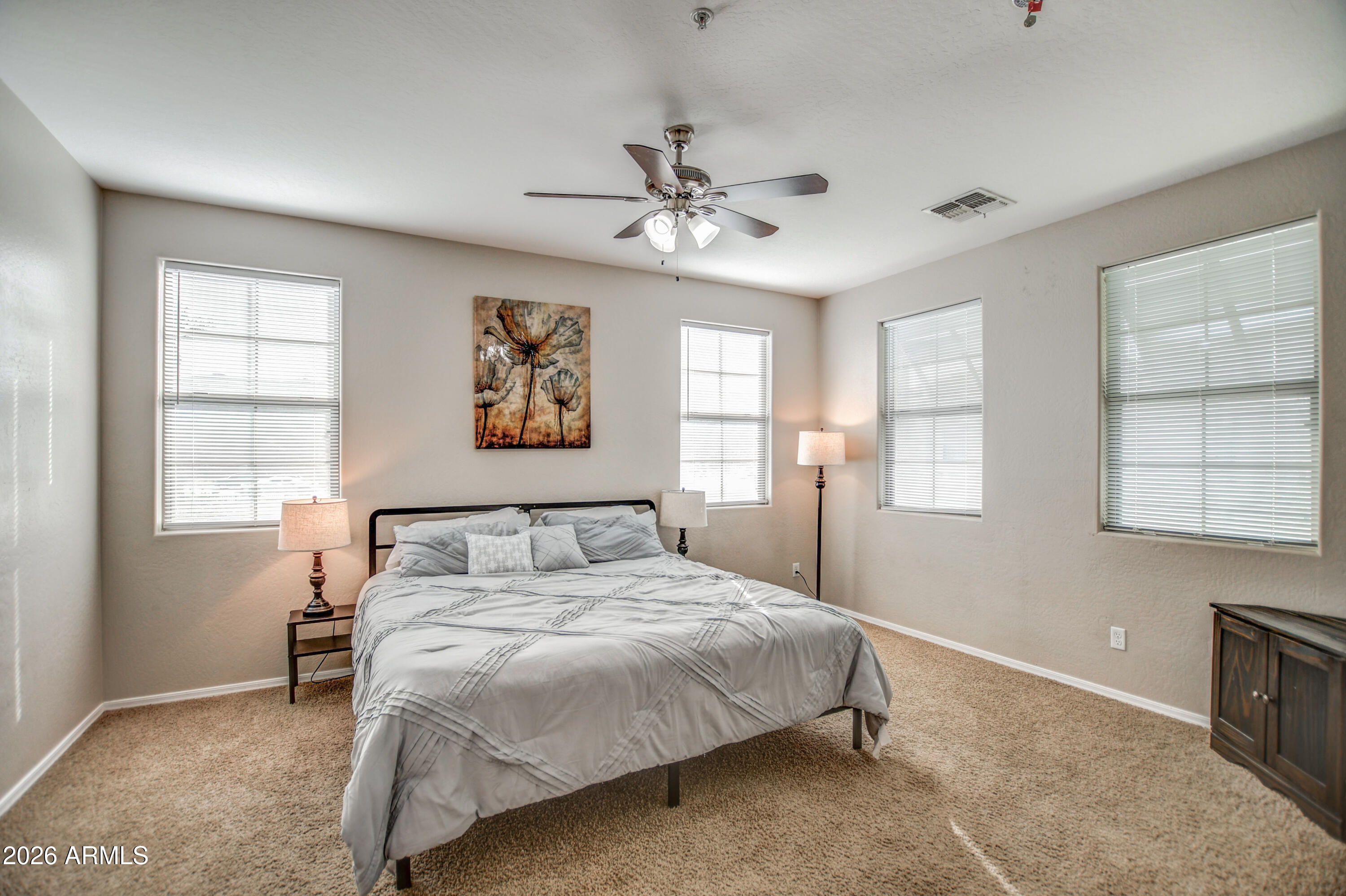 7515 South 30th Place Phoenix, AZ 85042 - Photo 9 of 23 a bedroom with a bed and a window