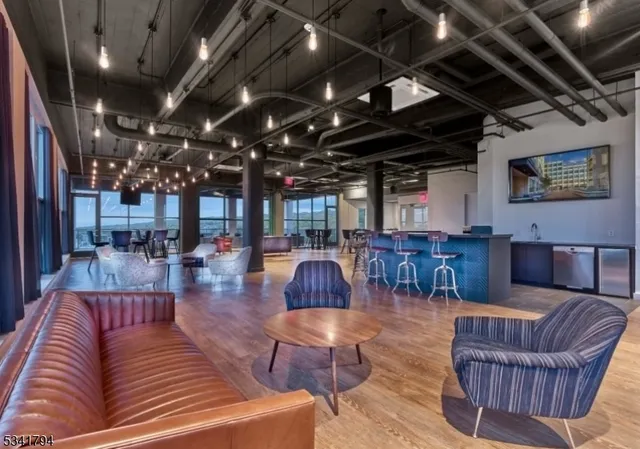 a outdoor living space with patio furniture and a fireplace