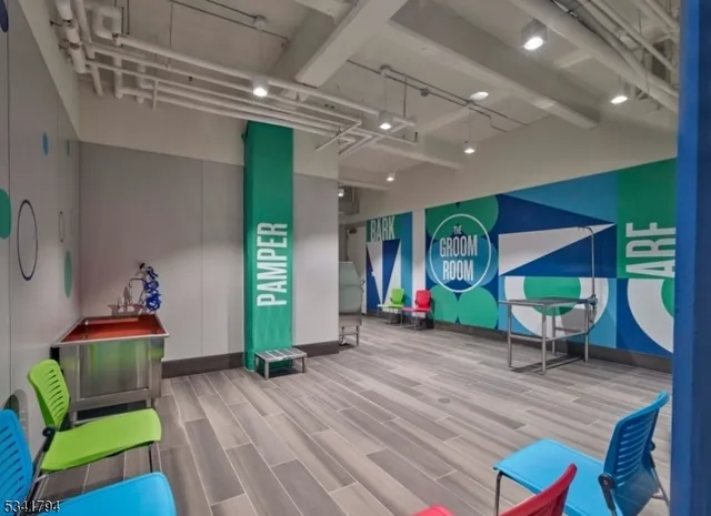 a kitchen with counter top space and living room