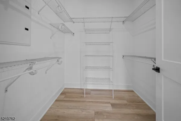 a bathroom with a double vanity sink toilet mirror and bathtub