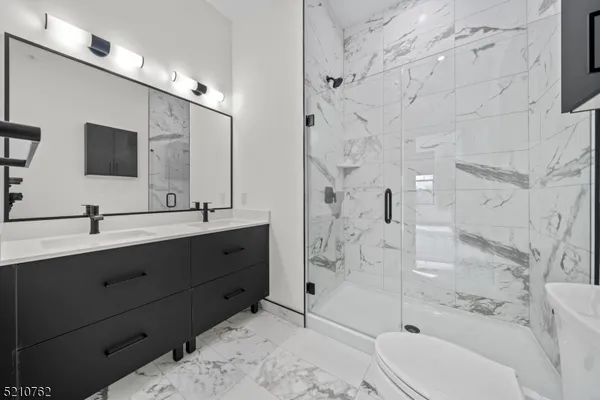 a bathroom with a toilet a sink and bathtub