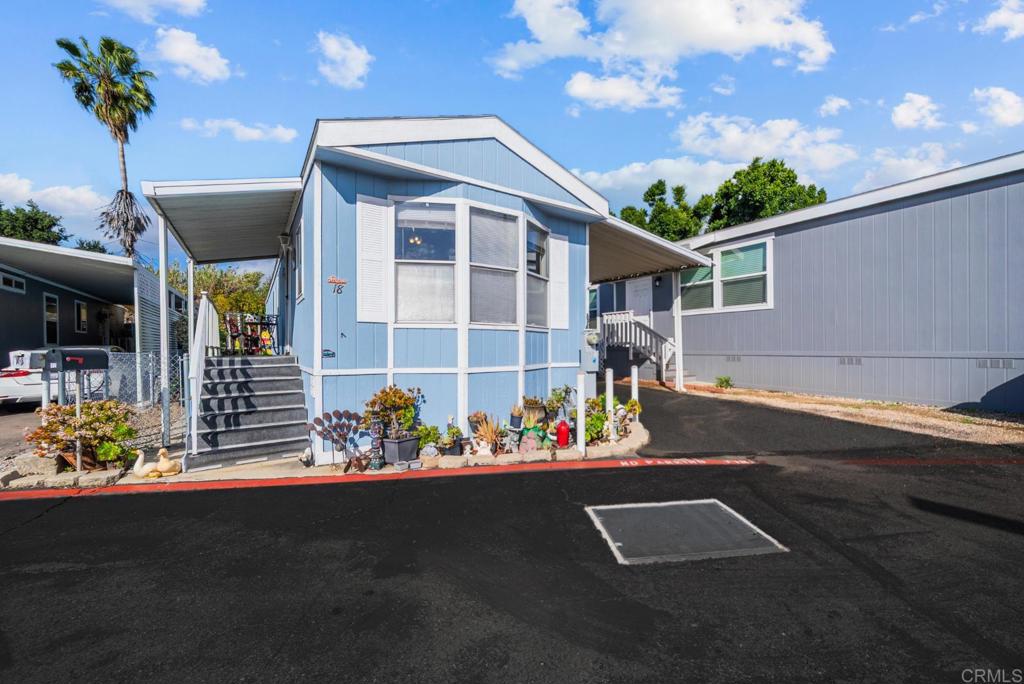 12044 Royal Road, Unit SPC 18 El Cajon, CA 92021 - Photo 1 of 24 a front view of a house