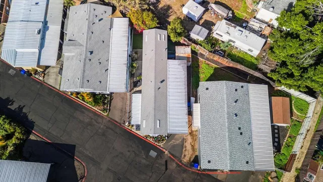 an aerial view of residential houses with outdoor space