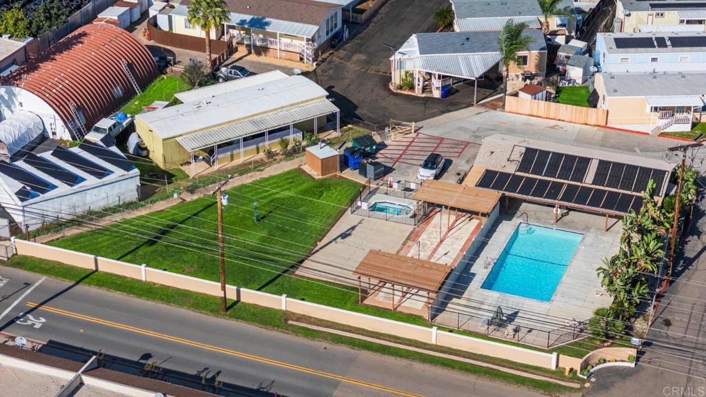 12044 Royal Road, Unit SPC 18 El Cajon, CA 92021 - Photo 21 of 24 an aerial view of a house with a garden and deck