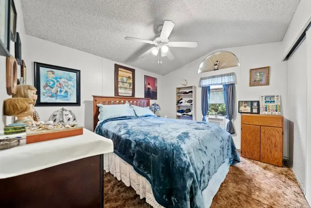 a bed room with a bed and dresser