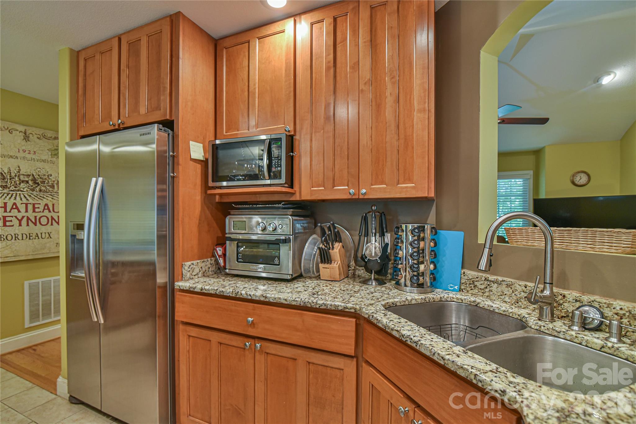 911 Fanning Bridge Road Fletcher, NC 28732 - Photo 11 of 28 a kitchen with granite countertop stainless steel appliances a refrigerator a sink and cabinets