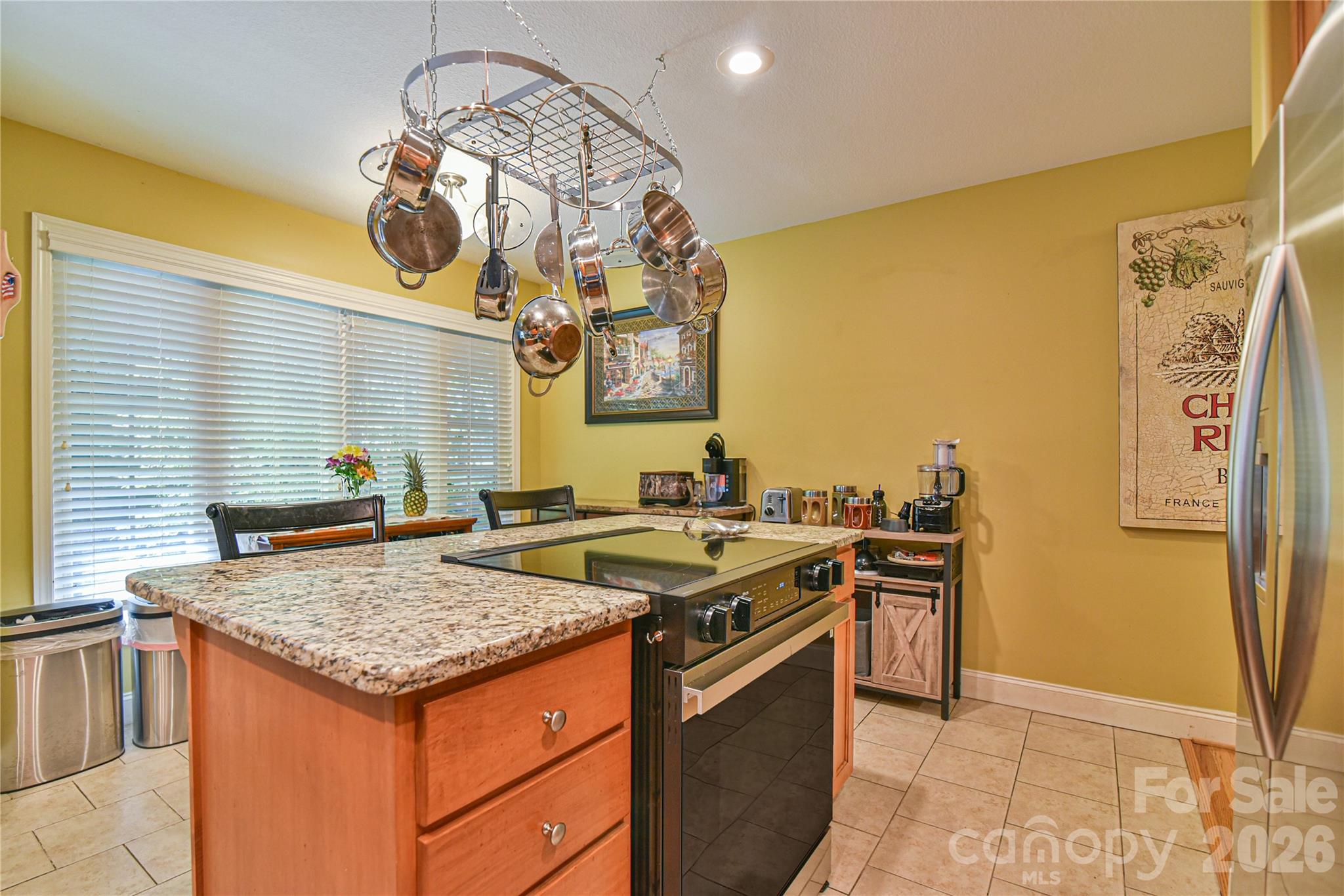 911 Fanning Bridge Road Fletcher, NC 28732 - Photo 12 of 28 a kitchen with a stove a sink and a refrigerator