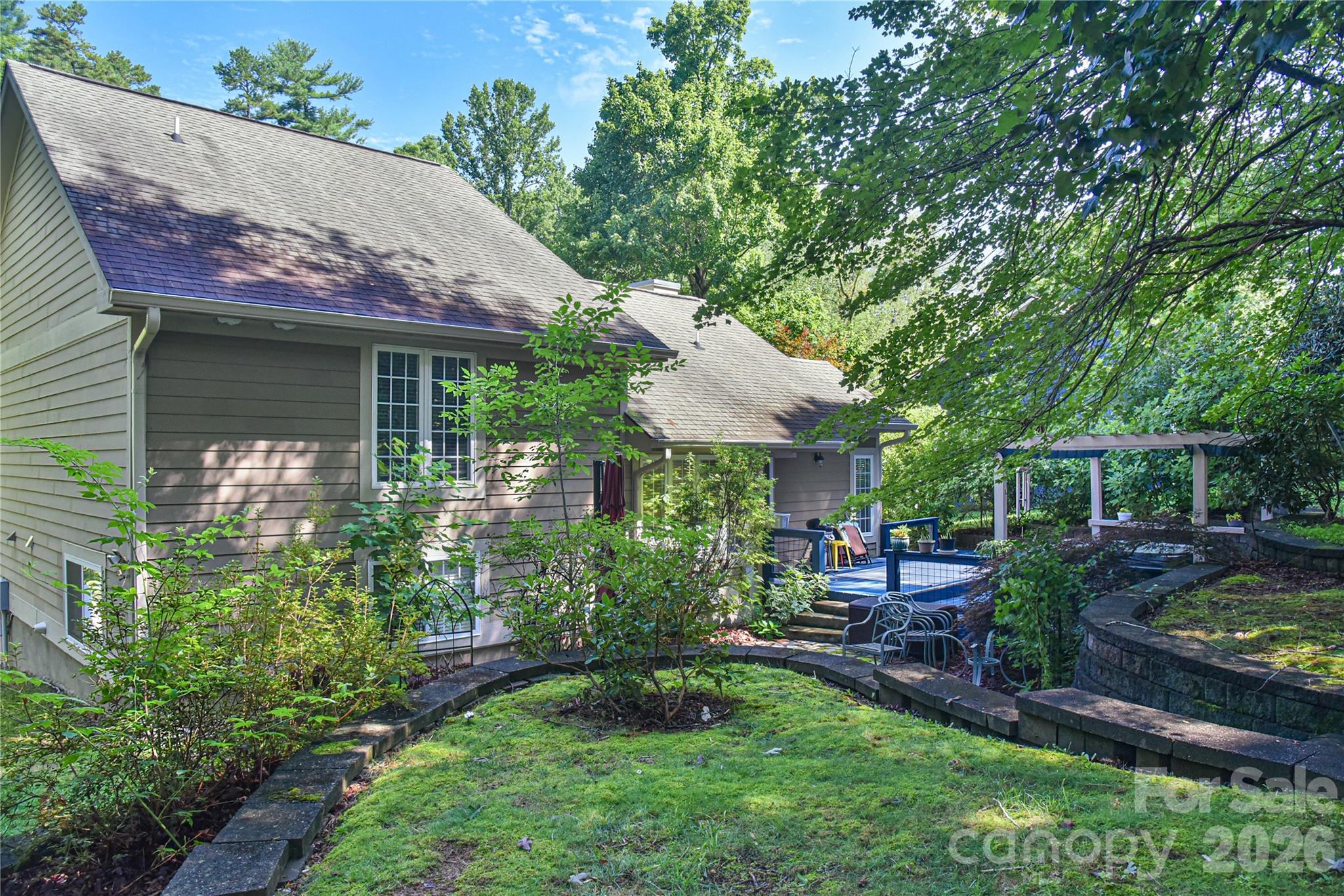 911 Fanning Bridge Road Fletcher, NC 28732 - Photo 2 of 28 a view of a house with backyard and sitting area