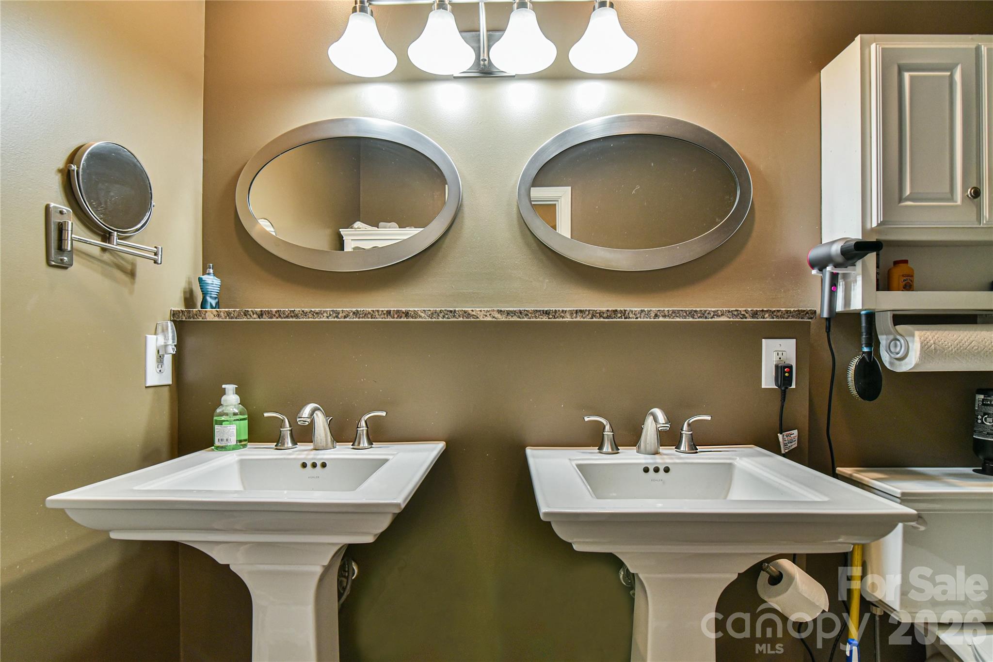 911 Fanning Bridge Road Fletcher, NC 28732 - Photo 21 of 28 a bathroom with a sink and a mirror