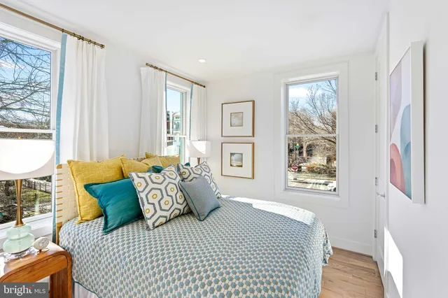 a bedroom with a large bed and a window