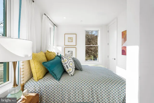 a bedroom with furniture and a window