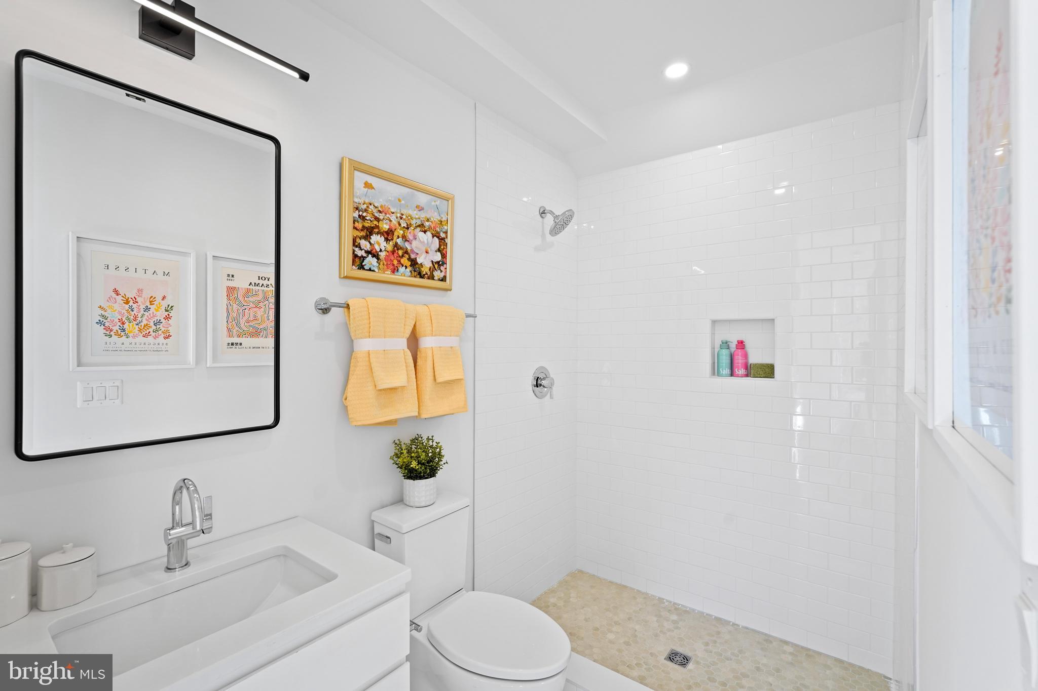 1237 W Street Northwest, Unit A Washington, DC 20009 - Photo 17 of 25 a bathroom with a sink toilet and vanity