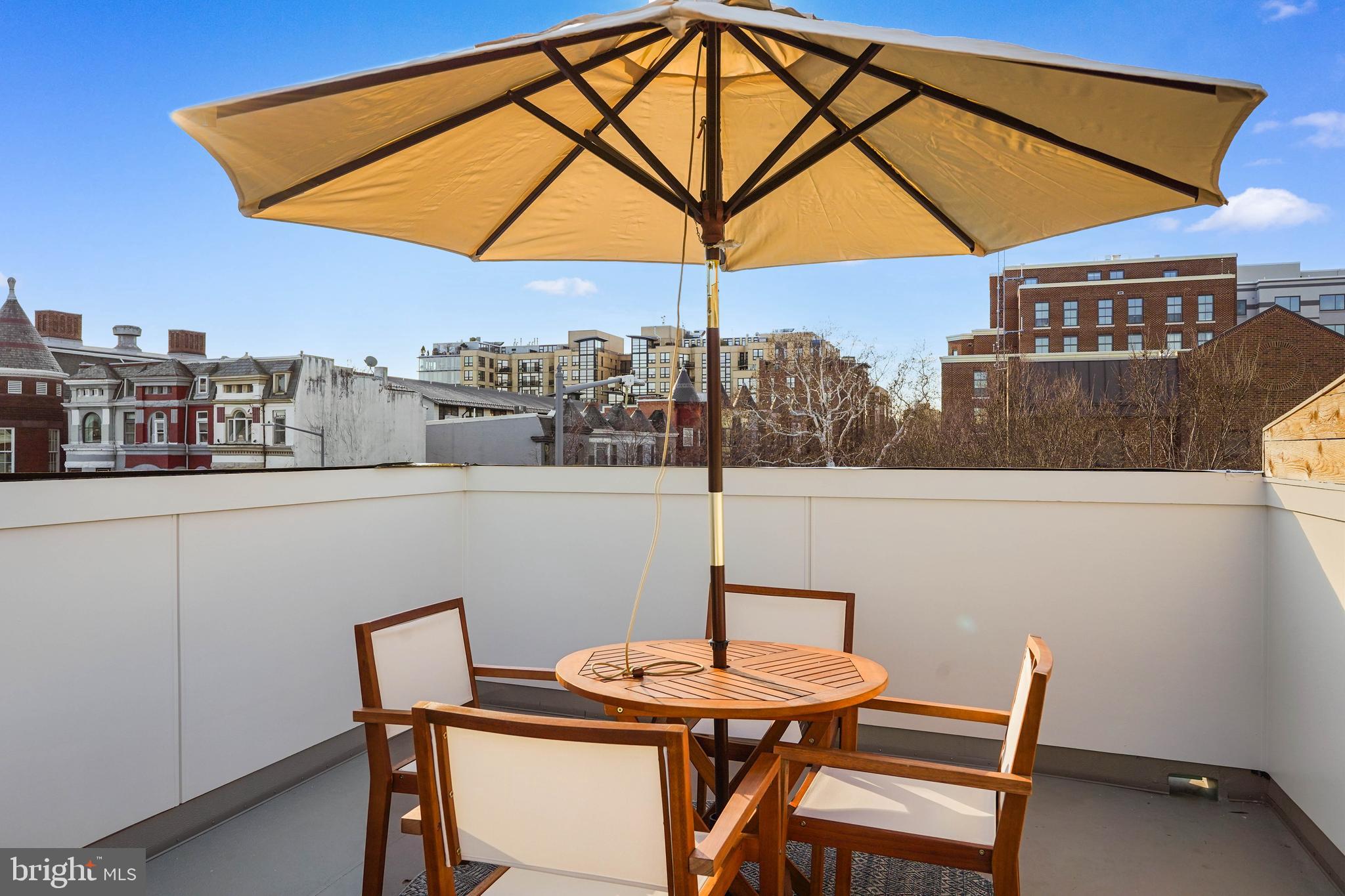 1237 W Street Northwest, Unit A Washington, DC 20009 - Photo 19 of 25 a table and chairs in the terrace