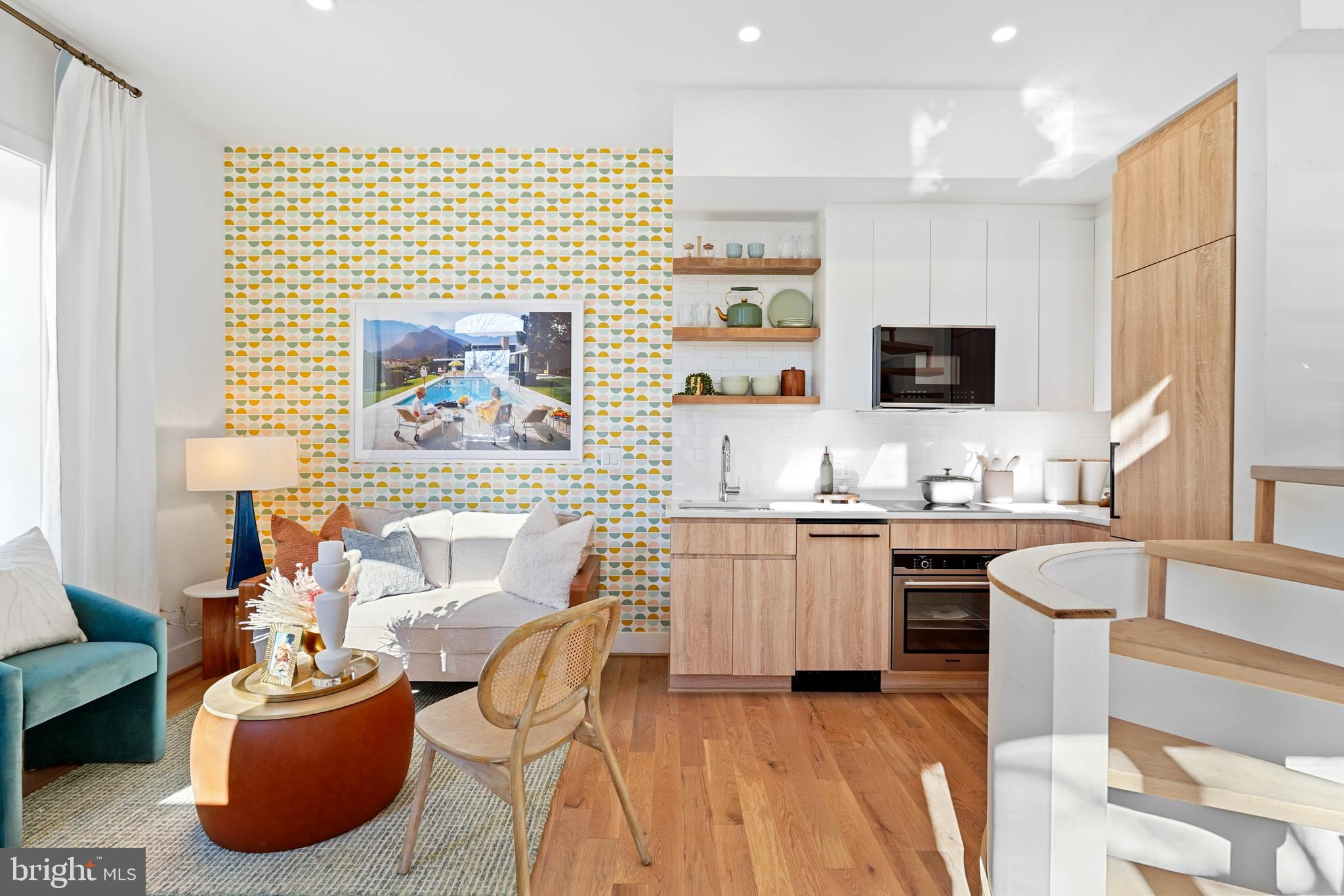 1237 W Street Northwest, Unit A Washington, DC 20009 - Photo 2 of 25 a living room with furniture and a flat screen tv