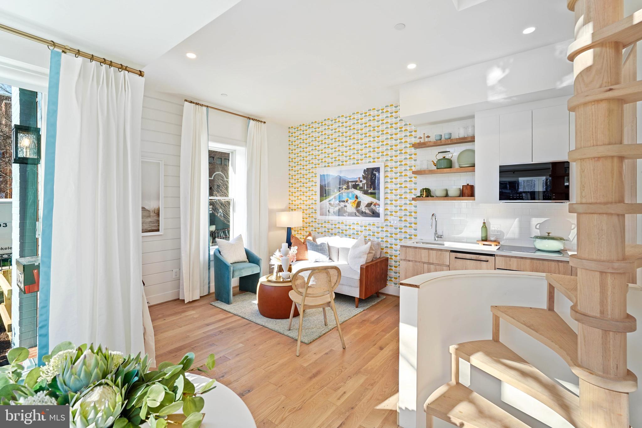 1237 W Street Northwest, Unit A Washington, DC 20009 - Photo 3 of 25 a living room with furniture kitchen view and a wooden floor
