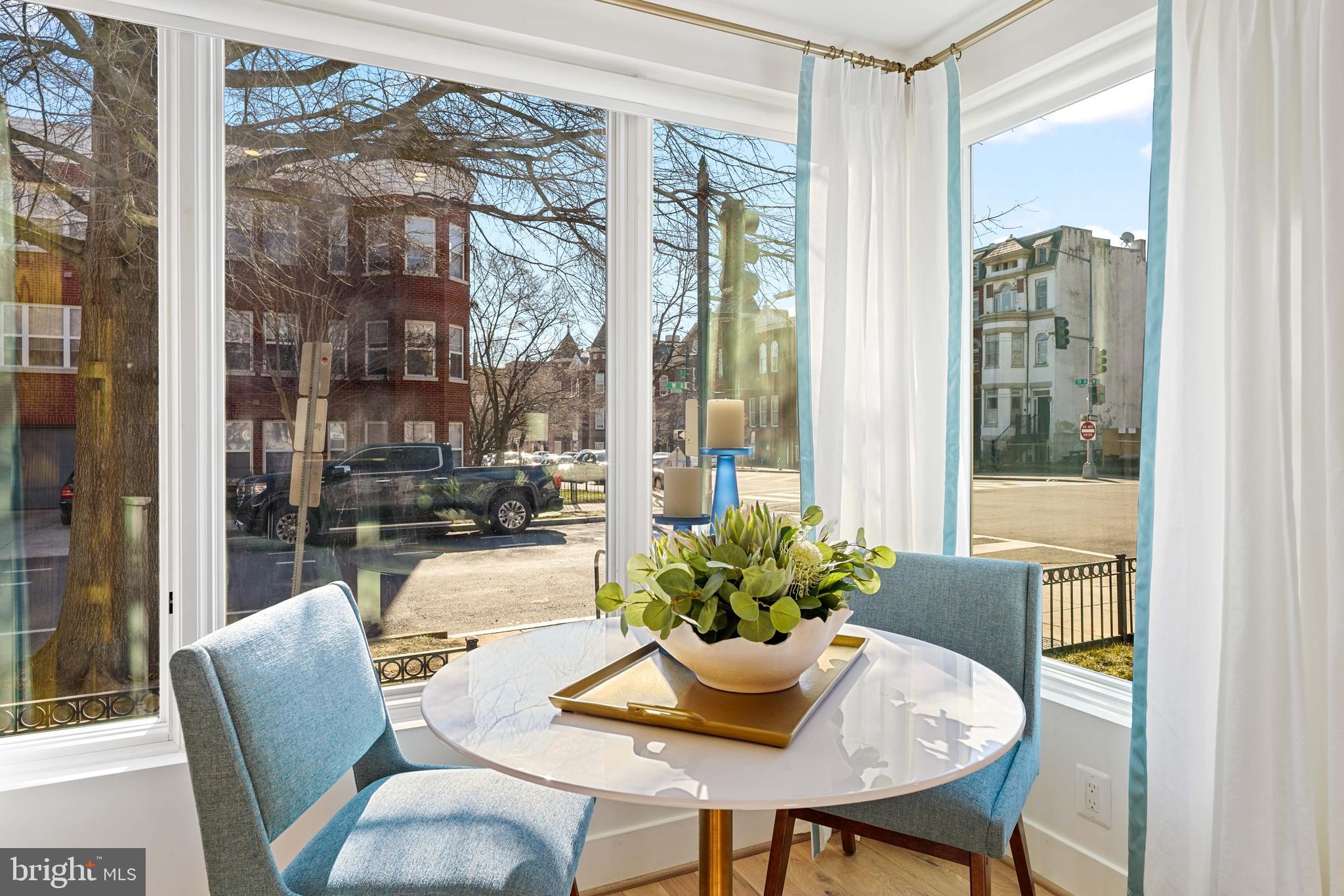 1237 W Street Northwest, Unit A Washington, DC 20009 - Photo 5 of 25 a dining room with furniture and a potted plant