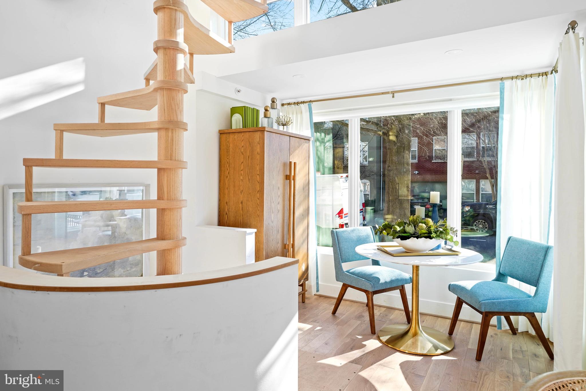 1237 W Street Northwest, Unit A Washington, DC 20009 - Photo 7 of 25 a living room with furniture and a large window