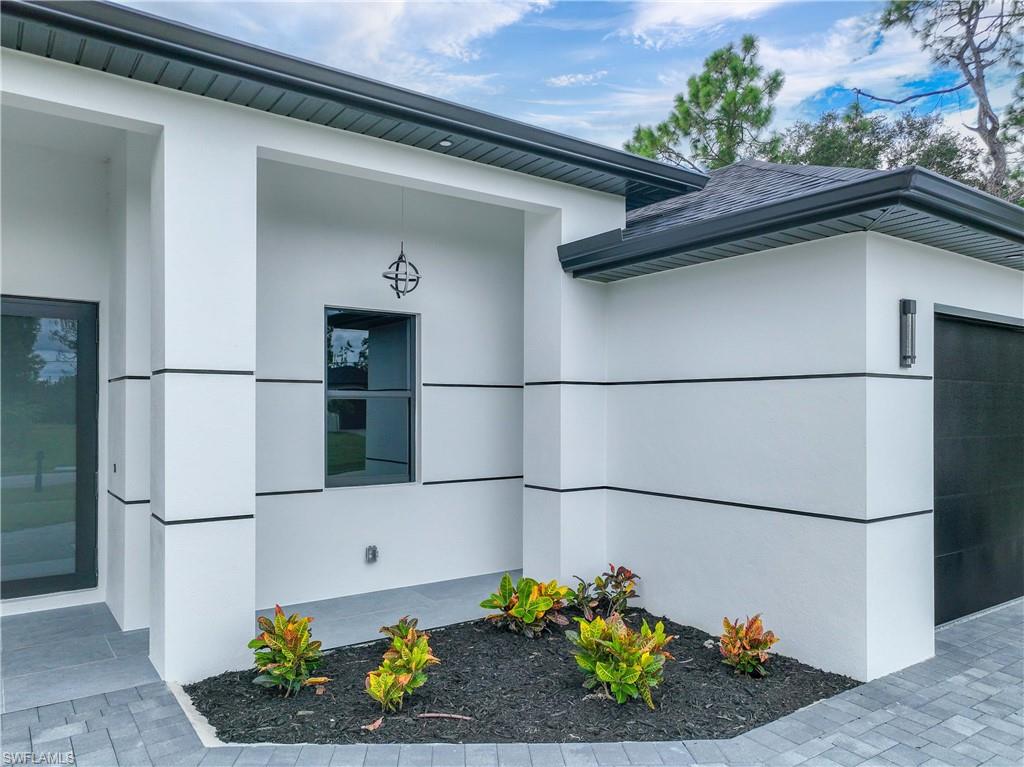3908 Sunset Road Lehigh Acres, FL 33971 - Photo 3 of 30 a front view of a house