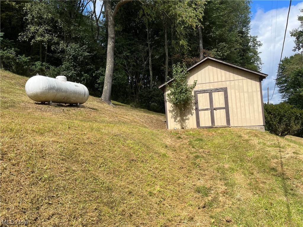 1220 Arner Road Chester, WV 26034 - Photo 22 of 24 View of yard featuring a storage unit