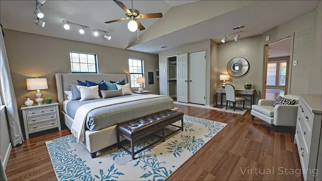 a bedroom with a bed window and a mirror