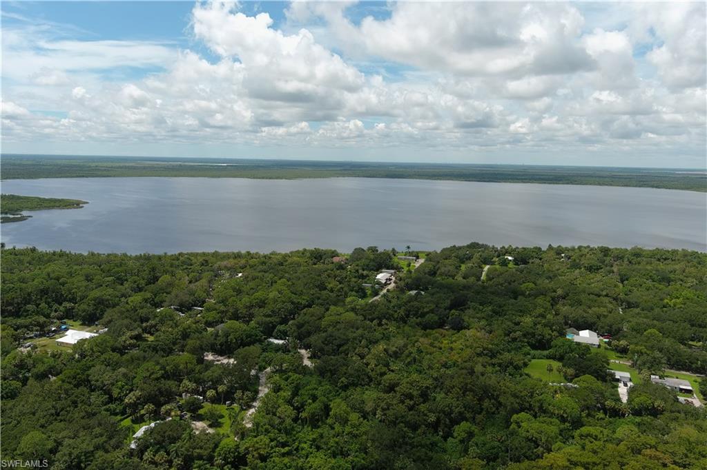5106 Taylor Road North Immokalee, FL 34142 - Photo 8 of 10 a view of a lake with a yard