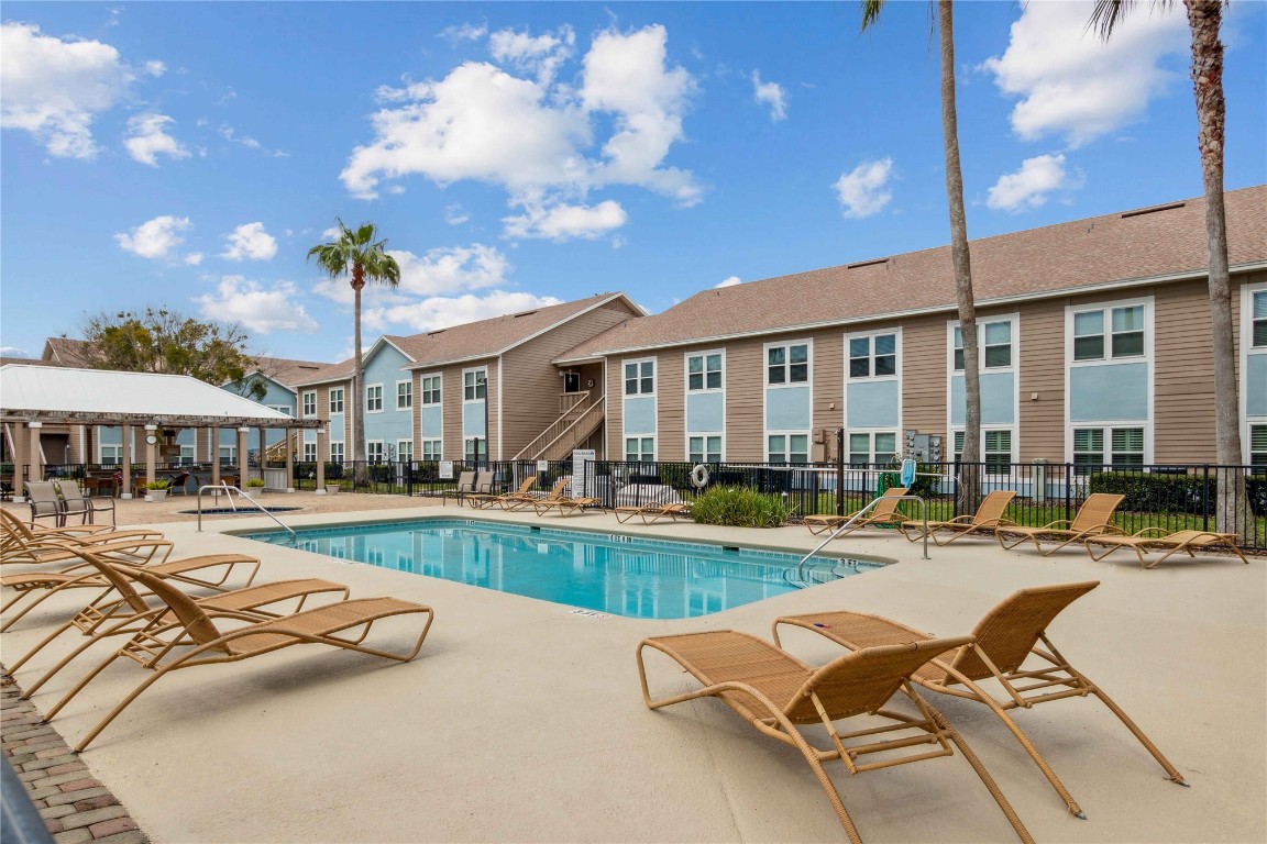 1601 Nectarine Street, Unit C5 Fernandina Beach, FL 32034 - Photo 20 of 25 a view of a house with swimming pool and sitting area