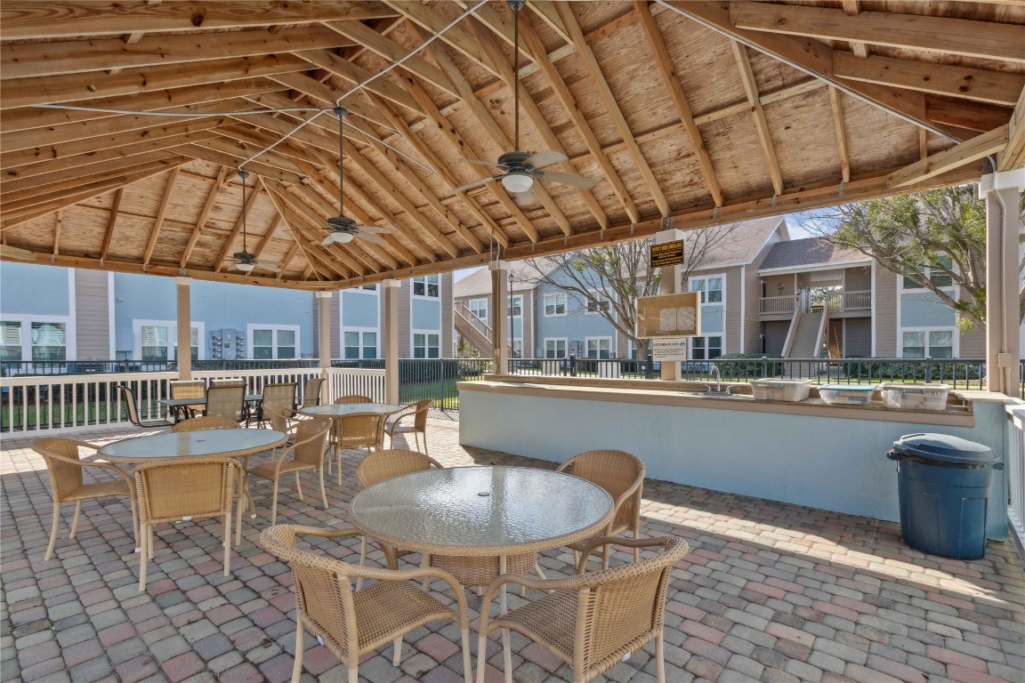 1601 Nectarine Street, Unit C5 Fernandina Beach, FL 32034 - Photo 24 of 25 a patio with a table and chairs