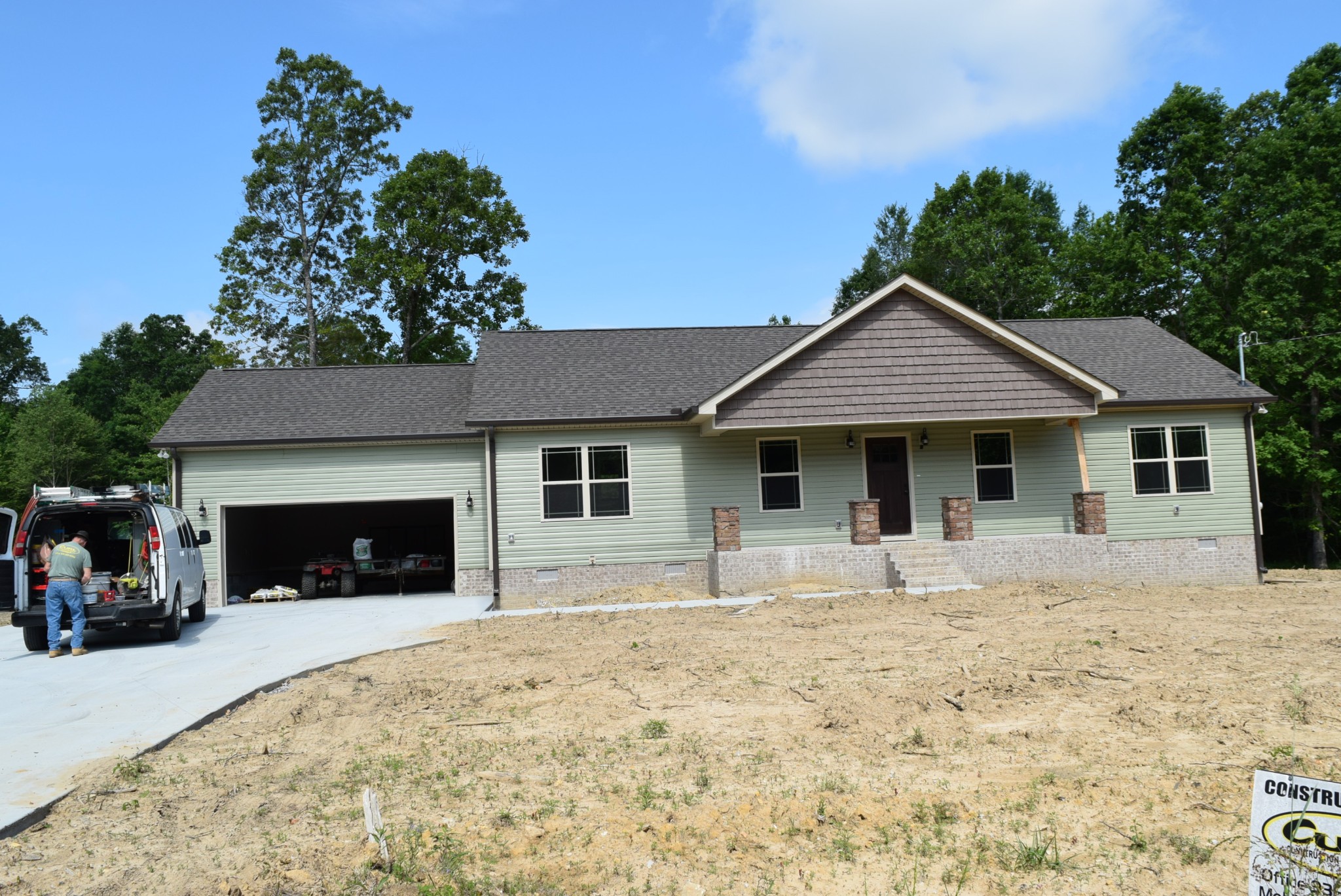382 Ballard Road Manchester, TN 37355 - Photo 1 of 10 a front view of a house with a yard and garage