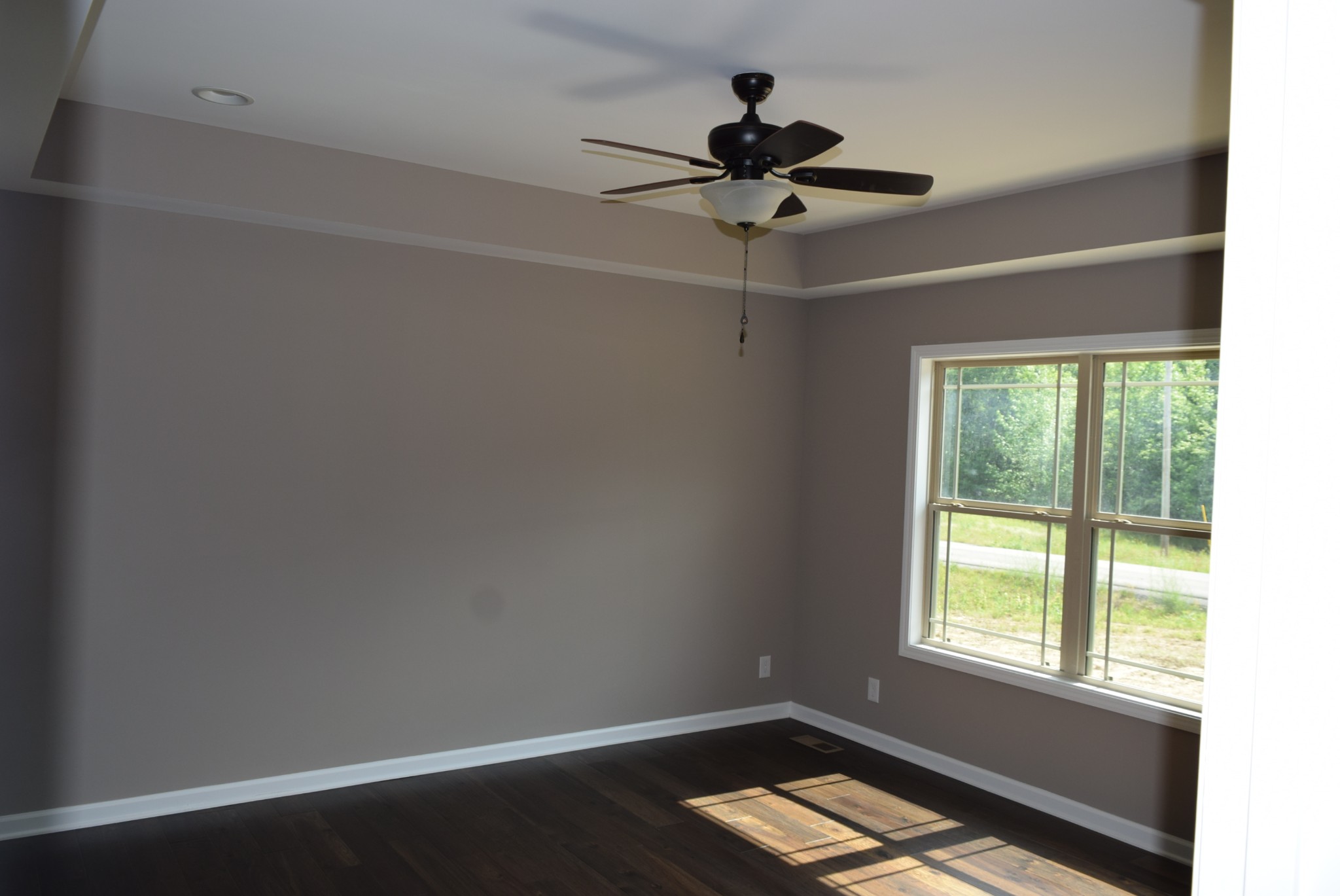 382 Ballard Road Manchester, TN 37355 - Photo 3 of 10 a view of room with window ceiling fan and hardwood floor