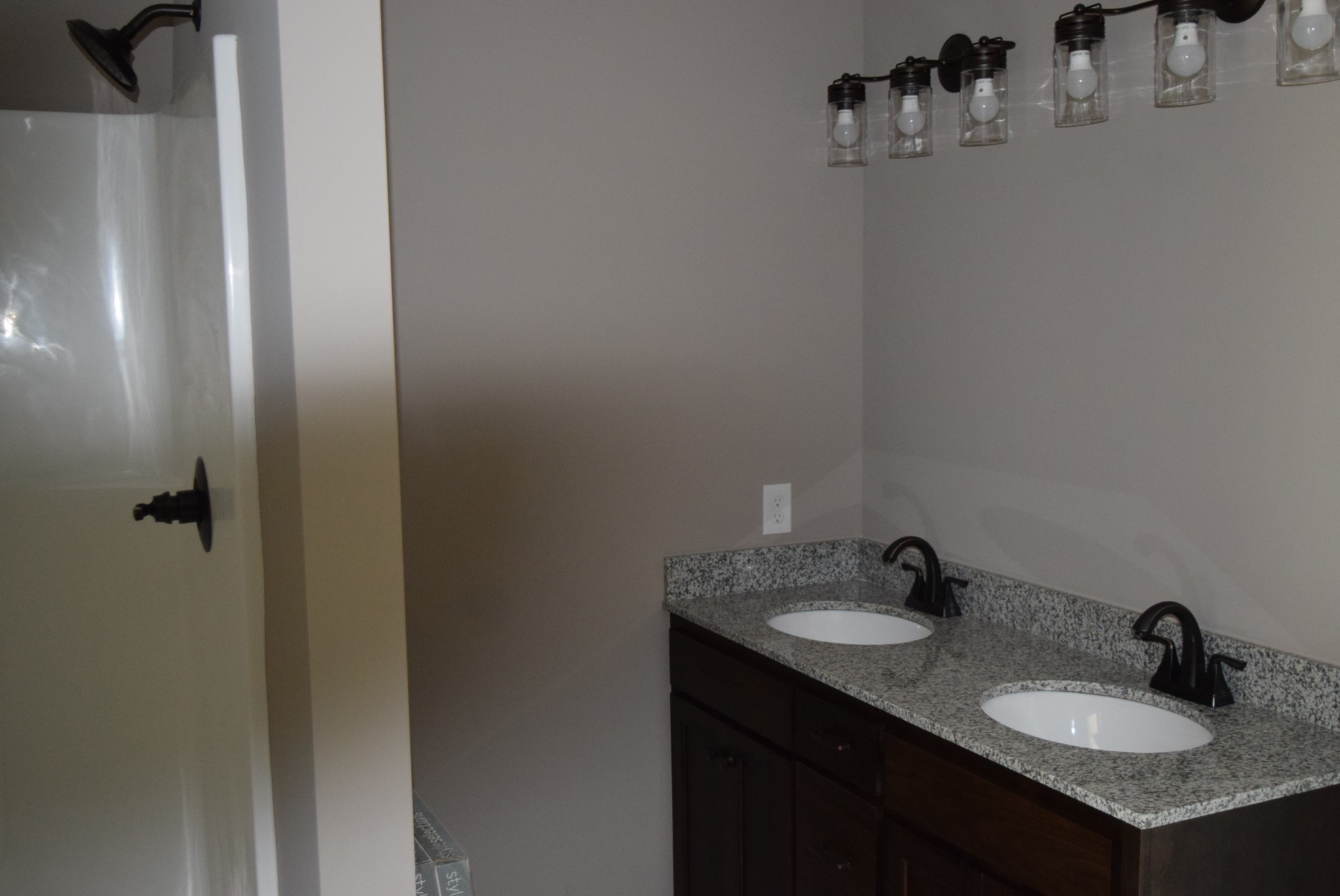 382 Ballard Road Manchester, TN 37355 - Photo 5 of 10 a bathroom with a granite countertop sink and a mirror