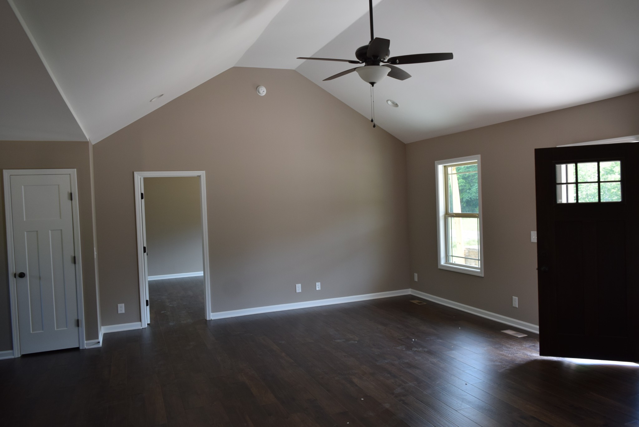 382 Ballard Road Manchester, TN 37355 - Photo 9 of 10 an empty room with wooden floor fan and windows
