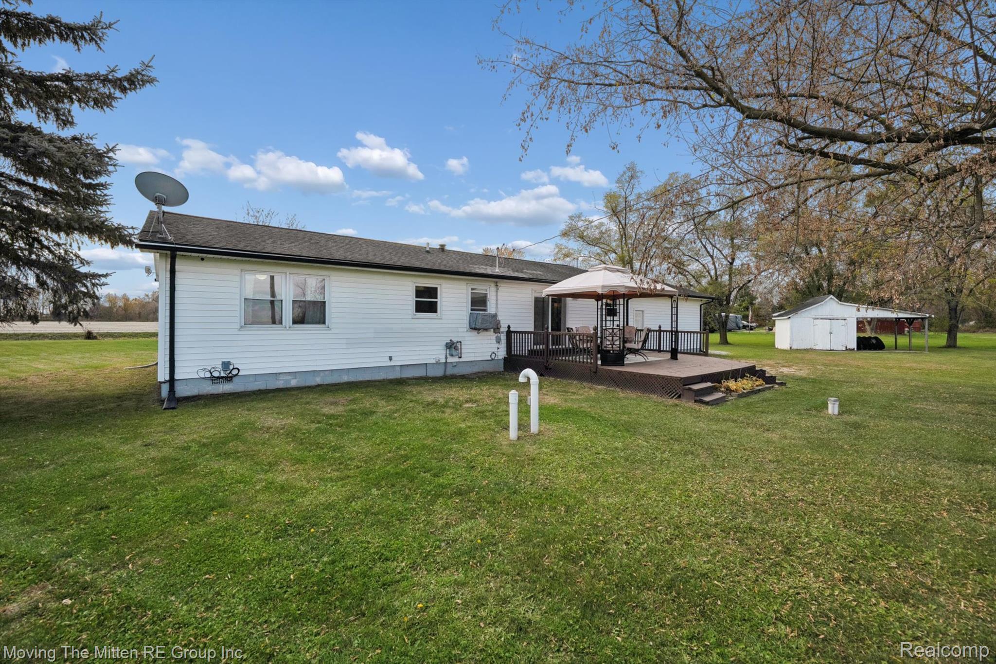12000 Plank Road Milan, MI 48160 - Photo 32 of 49 Rear view of property with a wooden deck, a lawn, an outdoor structure, and a gazebo