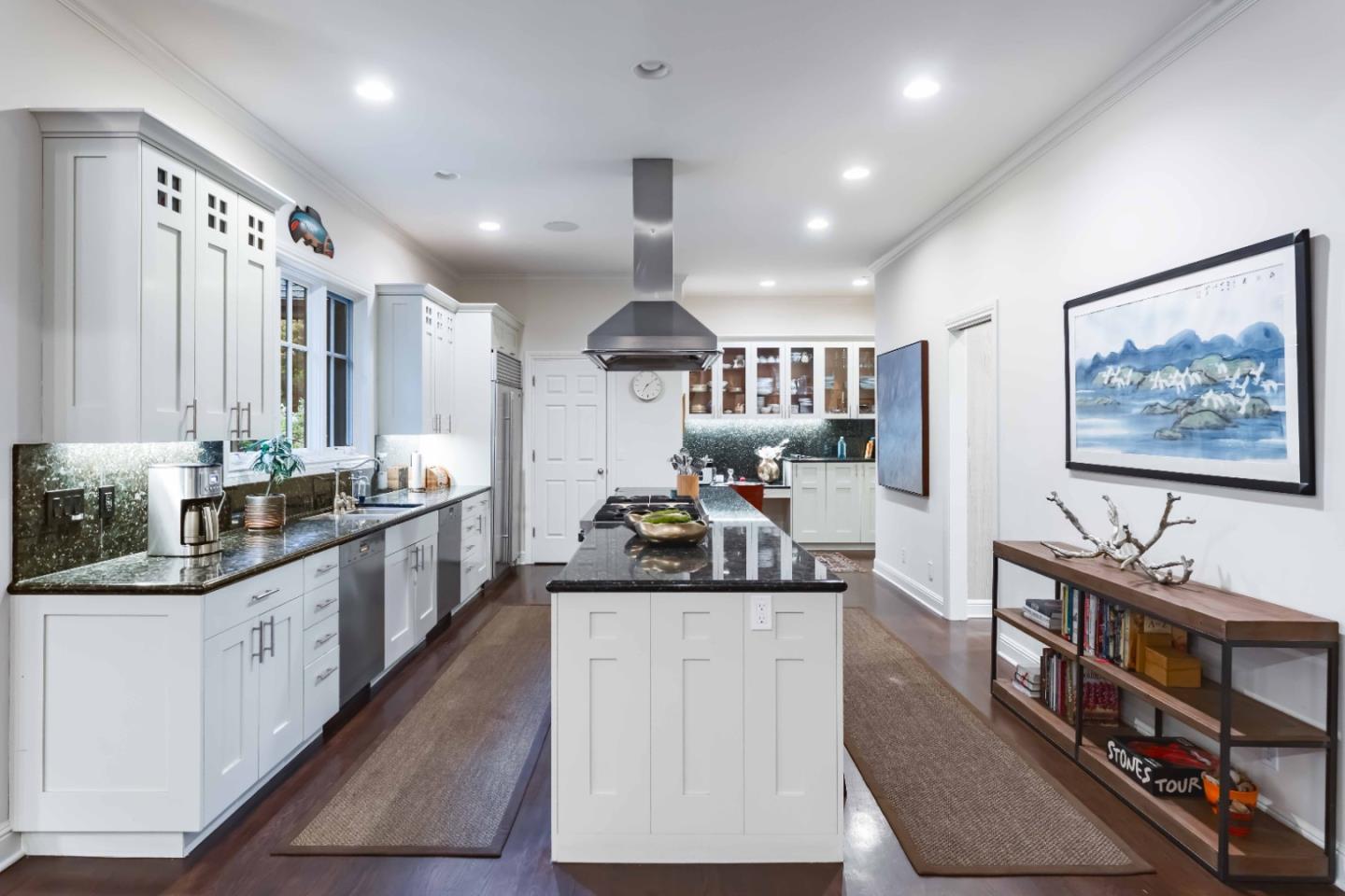 160 Phillip Road Woodside, CA 94062 - Photo 11 of 51 a kitchen with stainless steel appliances kitchen island granite countertop a stove a sink and a refrigerator