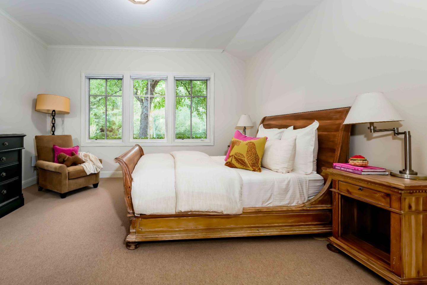 160 Phillip Road Woodside, CA 94062 - Photo 24 of 51 a bedroom with a bed and a lamp