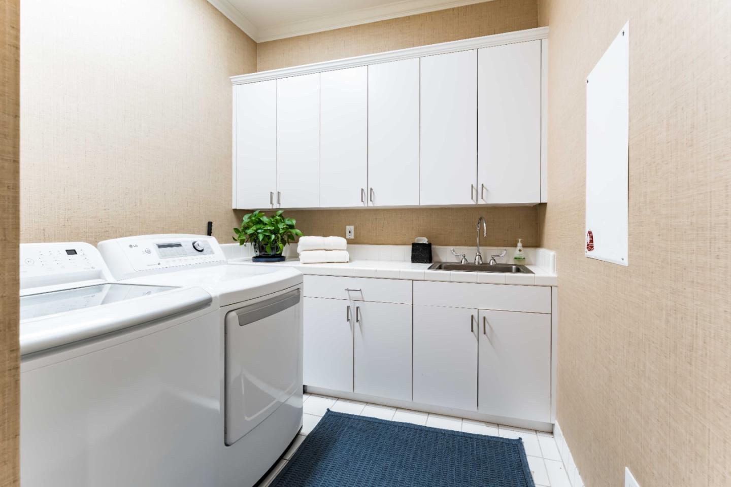 160 Phillip Road Woodside, CA 94062 - Photo 27 of 51 a room with a sink cabinets and utility