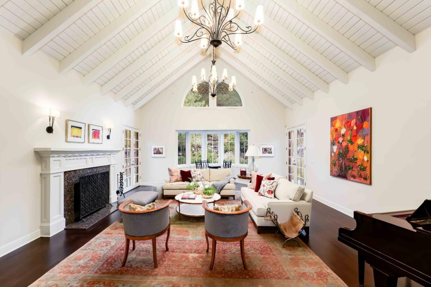 160 Phillip Road Woodside, CA 94062 - Photo 5 of 51 a living room with furniture a fireplace and a chandelier
