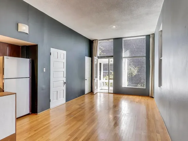 a view of livingroom with furniture wooden floor and window
