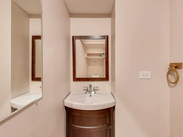 a bathroom with a sink and a mirror