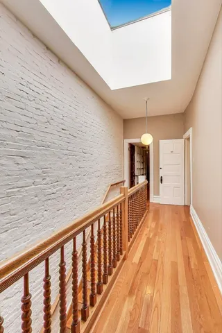 a view of a balcony with wooden floor