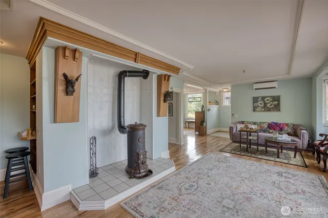 a view of a kitchen with microwave and furniture