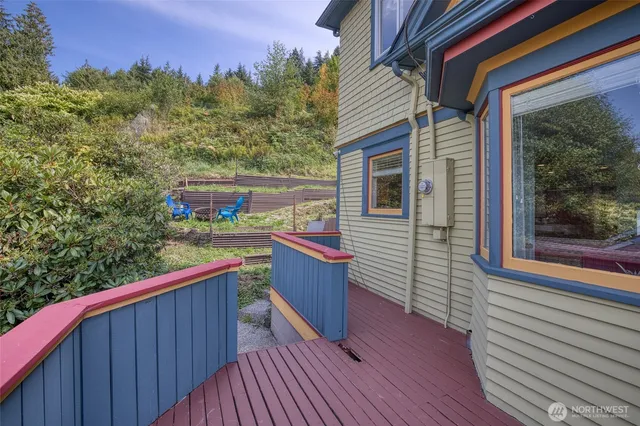 a kitchen with kitchen island granite countertop a sink cabinets and stainless steel appliances